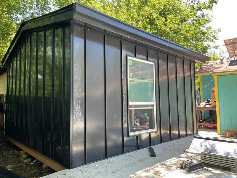 Black standing seam metal wall panels for Metal Roof Installation in Pemberton