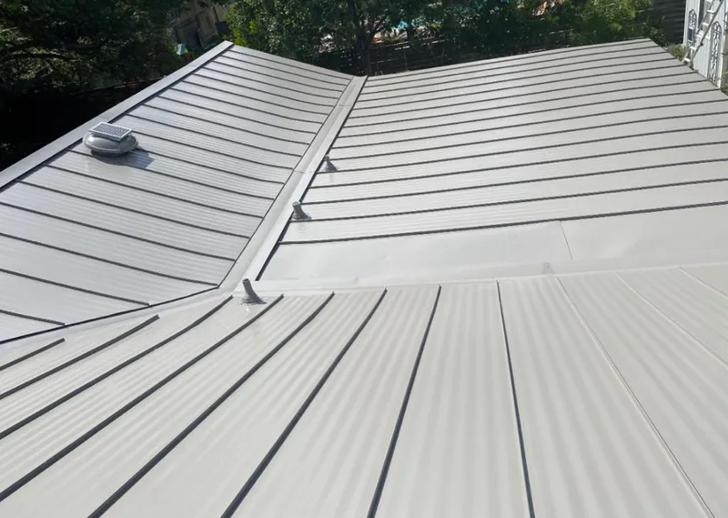 Solar attic fan installed on a metal roof for Roof Ventilation in Pemberton